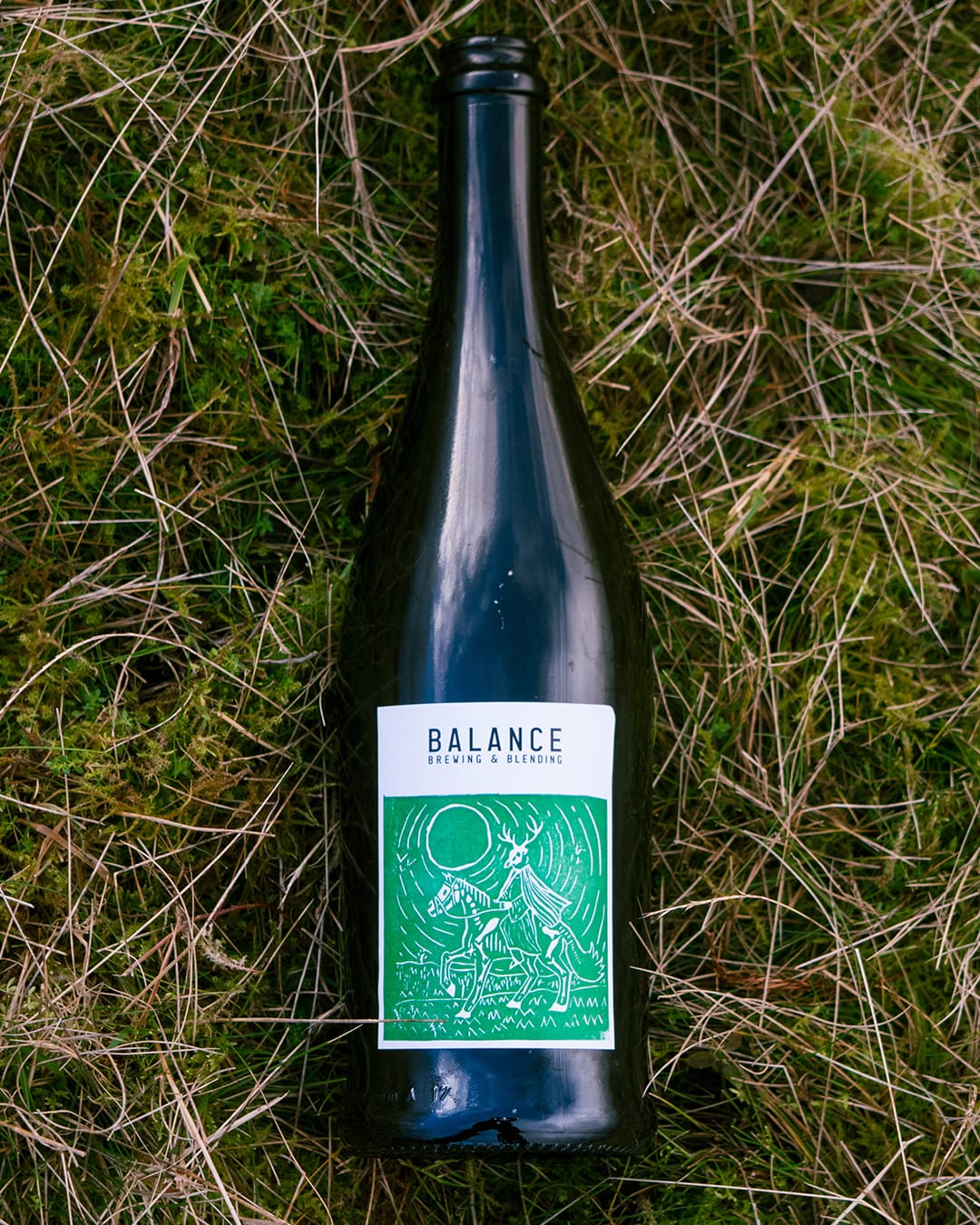 Headless Horseman lino print label design — hand-carved figurative illustration on craft beer bottle