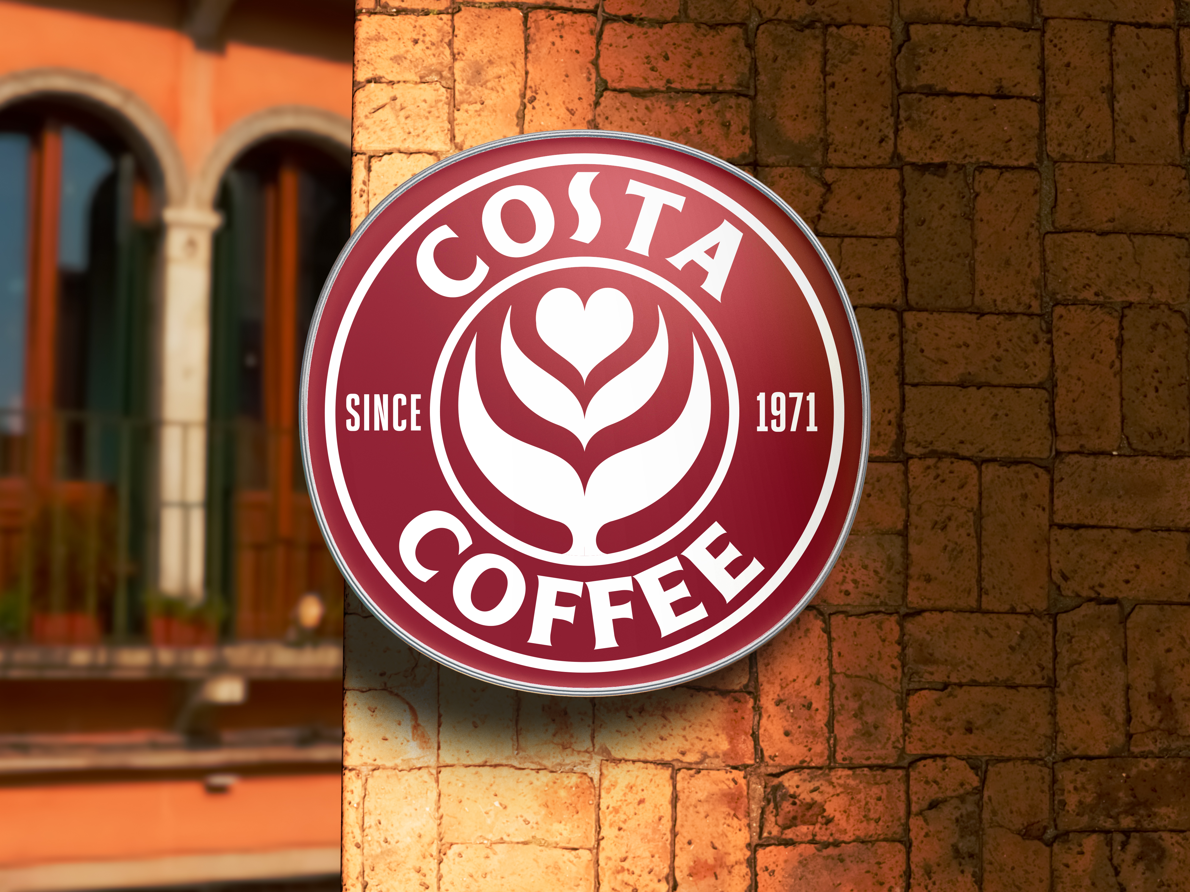 Costa Coffee 3D sign mockup on brick wall — environmental brand application showing the revised identity at scale